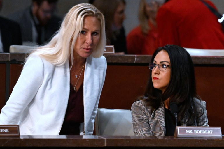 Rep. Marjorie Taylor-Greene (R-GA) takes her seat next to Rep. Lauren Boebert (R-CO).