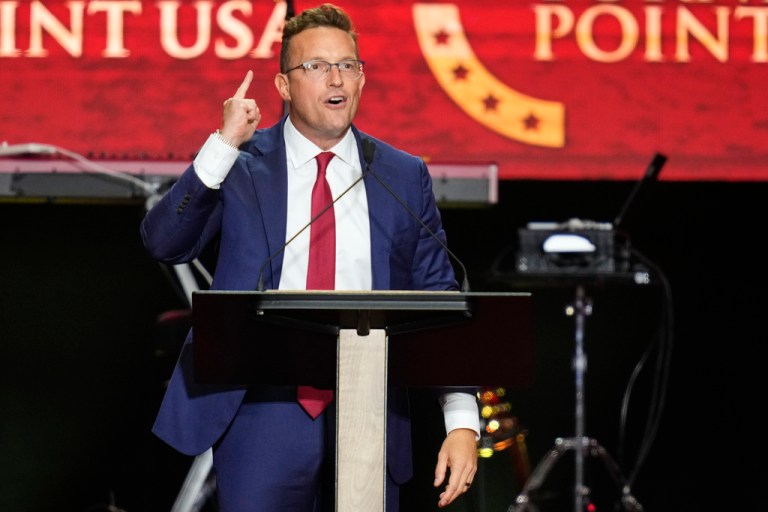Benny Johnson speaks at a memorial for conservative activist Charlie Kirk, Sunday, Sept. 21, 2025, at State Farm Stadium in Glendale, Ariz. (AP Photo/John Locher)