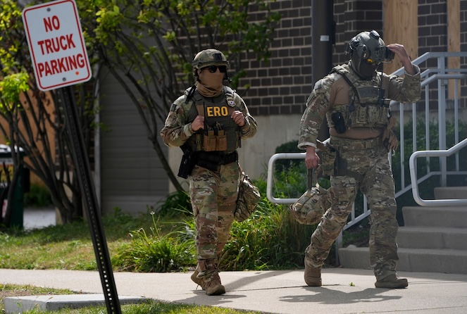 Enforcement and Removal Operations agents walk outside the U.S. Immigration and Customs Enforcement (ICE) building Wednesday, Sept. 24, 2025, in Broadview, Ill. (AP Photo/Erin Hooley)