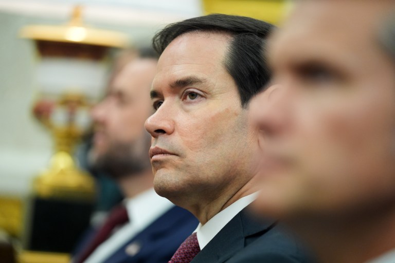 Secretary of State Marco Rubio stares during meeting in Oval Office.