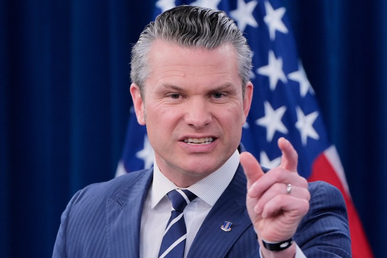 War Secretary Pete Hegseth speaks during a news conference.