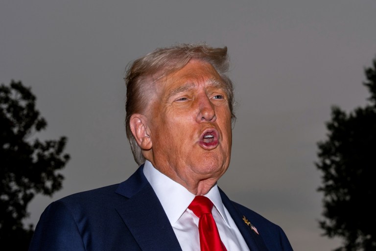 President Donald Trump speaks with reporters before departing on Marine One from the South Lawn of the White House, Tuesday, Sept. 30, 2025, in Washington. (AP Photo/Alex Brandon)