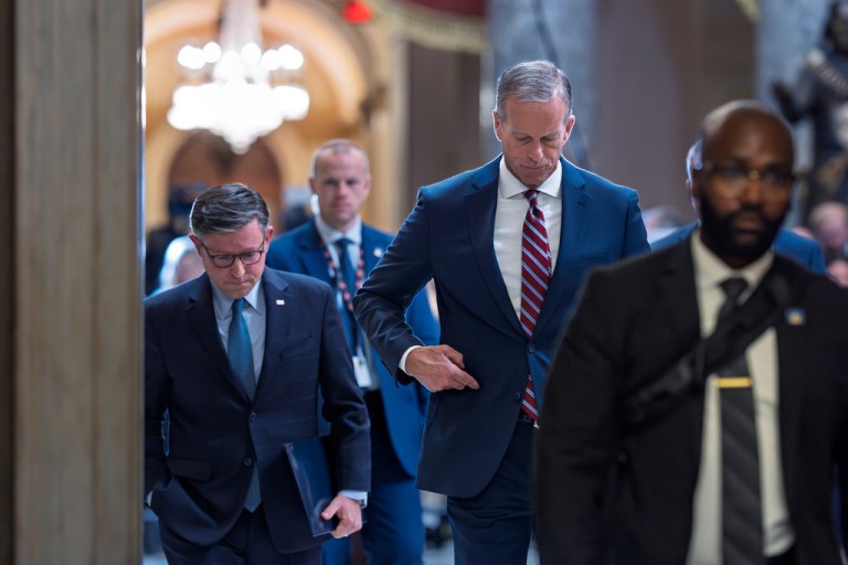 Speaker of the House Mike Johnson, R-La., left, and Senate Majority Leader John Thune, R-S.D., return to their offices after speaking with reporters on the third day of the government shutdown, at the Capitol in Washington, Friday, Oct. 3, 2025.