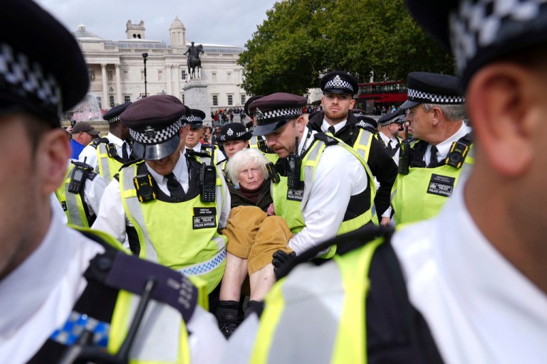 British police remove a pro-Palestinian protester from Trafalgar Square in London.