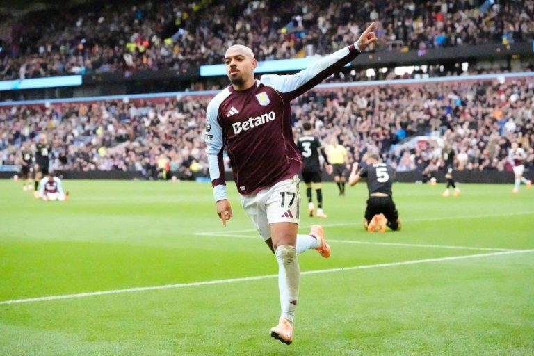 Aston Villa's Donyell Malen celebrates scoring a goal.