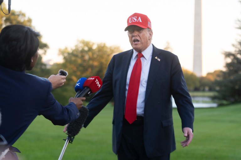 President Donald Trump speaks to reporters upon arrival on the south Lawn at the White House in Washington, Sunday, Oct. 5, 2025