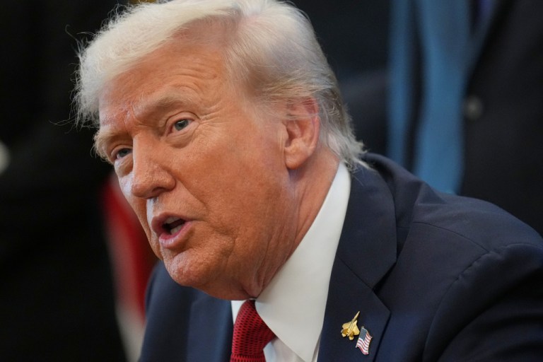 President Donald Trump speaks to reporters.