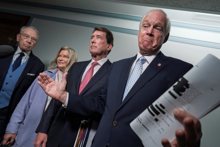 From left, Senate Judiciary Committee Chairman Chuck Grassley, R- Iowa, Sen. Cynthia Lummis, R-Wyo., Sen. Bill Hagerty, R-Tenn., and Sen. Ron Johnson, R-Wis., chairman of the Permanent Subcommittee on Investigations, speak with reporters at the Capitol in Washington, Monday, Oct. 6, 2025