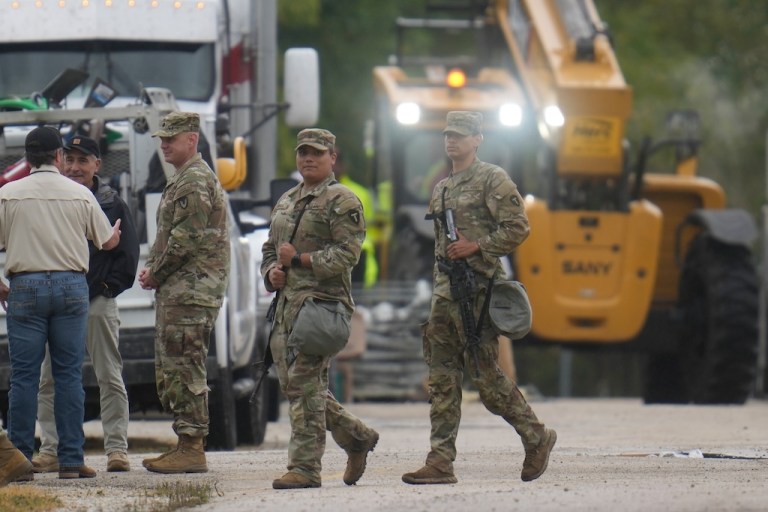 Military personnel in uniform.