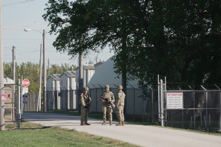 Military personnel in uniform, with the Texas National Guard patch on, are seen at the U.S. Army Reserve Center, Wednesday, Oct. 8, 2025, in Elwood, Ill., a suburb of Chicago. (AP Photo/Laura Bargfeld)