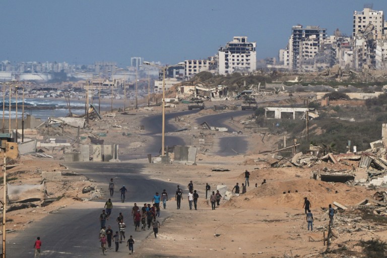 Israeli tanks block the beach road to Gaza City.