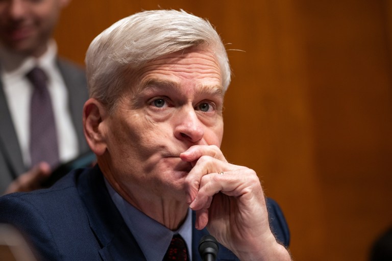 Sen. Bill Cassidy (R-LA) listens at a hearing on the effects of artificial intelligence on American families and the workforce.
