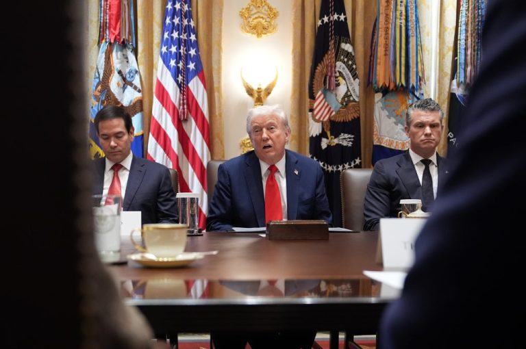 Secretary of State Marco Rubio and War Secretary Pete Hegseth listen as President Donald Trump speaks during a Cabinet meeting.