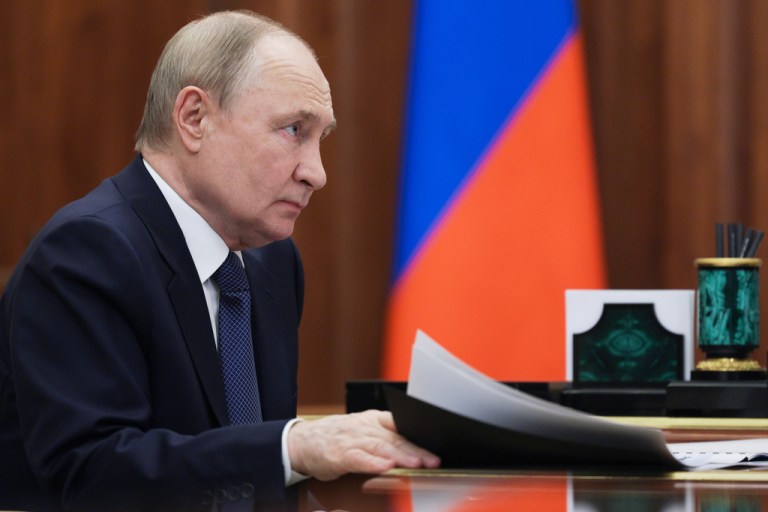 Russian President Vladimir Putin attends a meeting