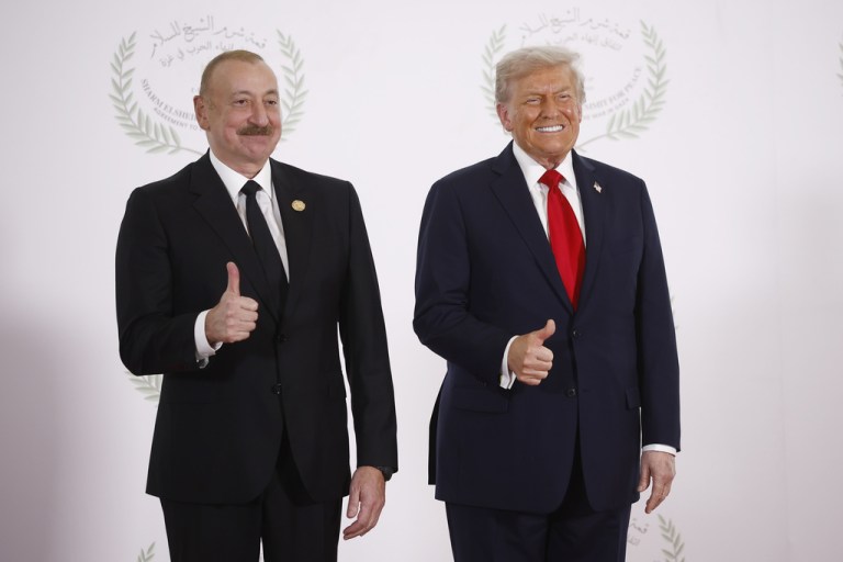 Azerbaijani President Ilham Aliyev and President Donald Trump give a thumbs-up for a picture.