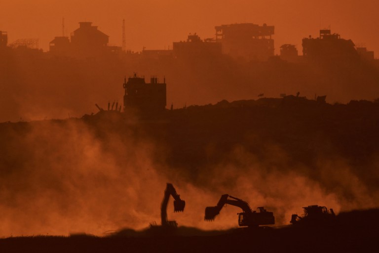 Israeli excavators work in the Gaza Strip.