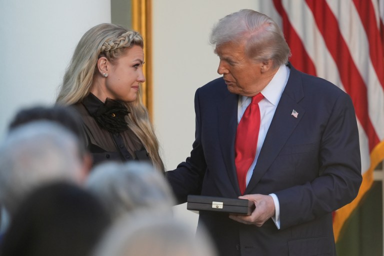 President Donald Trump presents the Presidential Medal of Freedom, to Erika Kirk for her late husband.