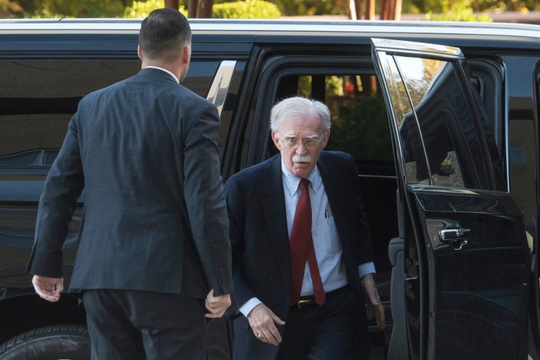 Former Trump administration national security adviser John Bolton arrives for his arraignment