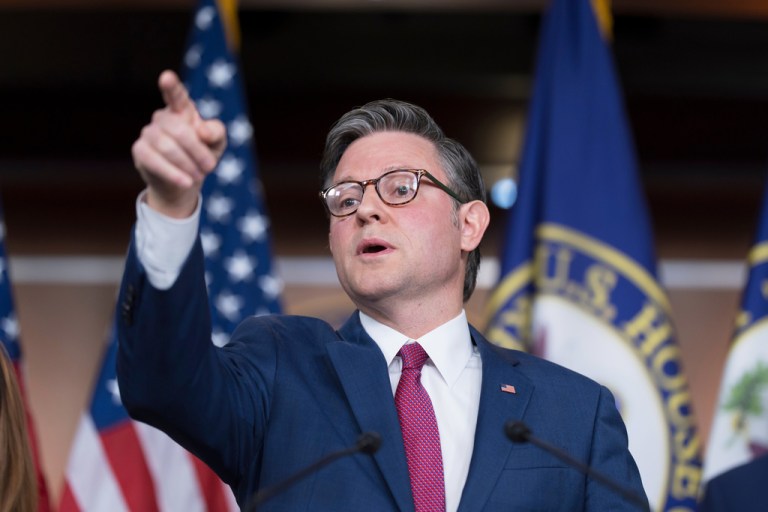 House Speaker Mike Johnson (R-LA) points to reporters.