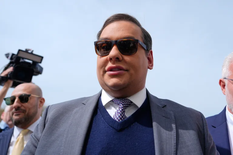 Former U.S. Rep. George Santos arriving to federal court in April.