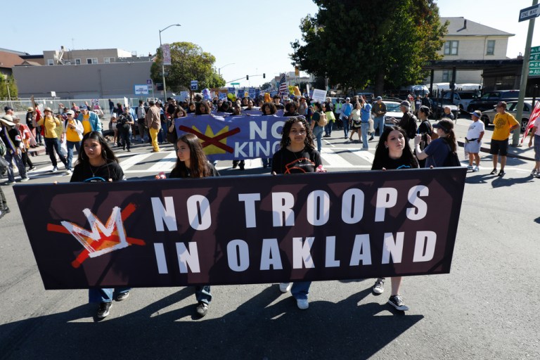 Demonstrators rally as they march in Oakland, Calif., during the second nationwide 