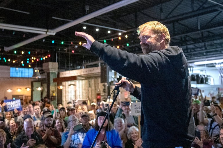 Senate candidate Graham Platner acknowledges the large crowd that attended Platner's town hall, Sept. 25, 2025, at Bunker Brewing in Portland, Maine.