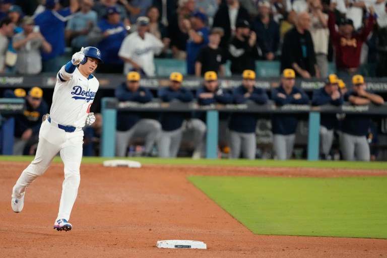 Los Angeles Dodgers' Shohei Ohtani celebrates as he rounds the bases after hitting home run during the seventh inning against the Milwaukee Brewers in Game 4 of baseball's National League Championship Series, Friday, Oct. 17, 2025, in Los Angeles. (AP Photo/Mark J. Terrill, File)