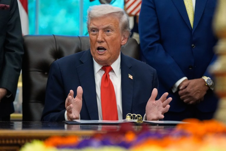 President Donald Trump answers questions from reporters during a Diwali celebration in the Oval Office at the White House, Tuesday, Oct. 21, 2025, in Washington.