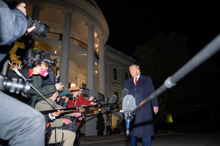 President Donald Trump talks to reporters as he departs the White House, Friday, Oct. 24, 2025, in Washington, for a trip to Asia. (AP Photo/Allison Robbert)