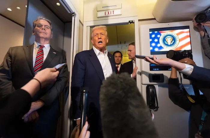President Donald Trump, second from left, joined by, from left, Treasury Secretary Scott Bessent, Secretary of State Marco Rubio, and U.S. Trade Representative Jamieson Greer, speaks to reporters aboard Air Force One while traveling from Kuala Lumpur, Malaysia, to Tokyo, Japan, Monday, Oct. 27, 2025.