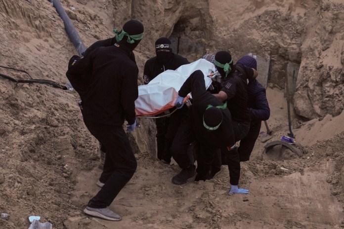 Hamas personnel recover Israeli hostage bodies