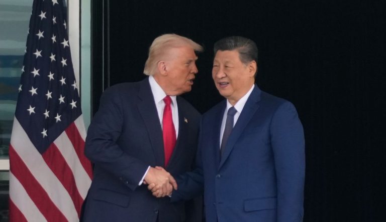 President Donald Trump and Chinese President Xi Jinping shake hands.