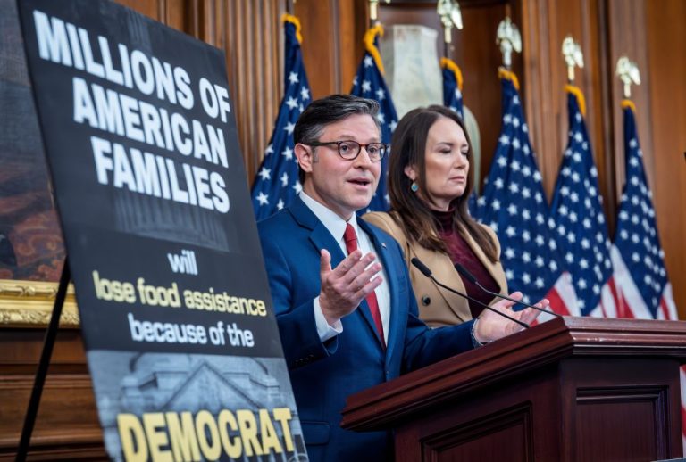 Mike Johnson, left, is joined by Secretary of Agriculture Brooke Rollins at a news conference to talk about SNAP food aid benefits on day 31 of the government shutdown.