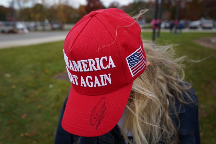 Debbie Allen, a member of "Trump's Corner" in Bedminster, New Jersey, displays her "MAGA" hat