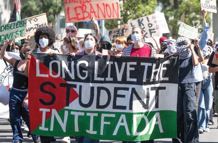 On the anniversary of the Hamas attack on Israel, University of Southern California students walk out of class and march around their campus in support of Palestinians and the divestment movement, Oct. 7, 2024, in Los Angeles. (Sarah Reingewirtz, Los Angeles Daily News/SCNG)