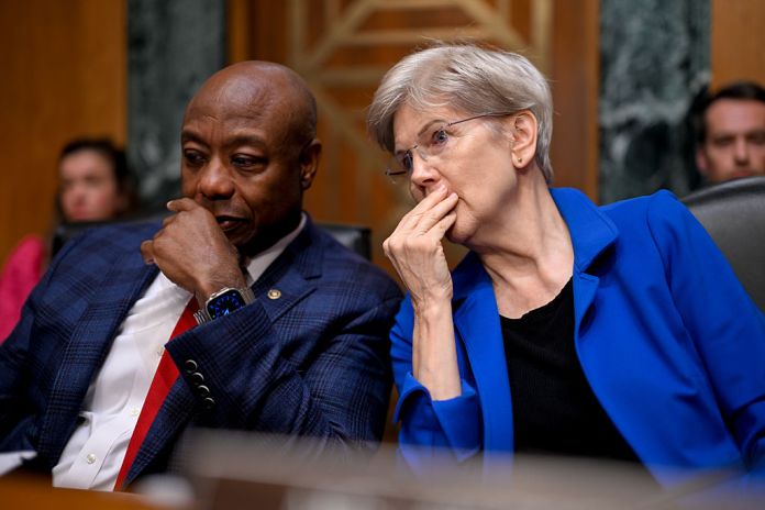 Senator Tim Scott, a Republican from South Carolina and chairman of Senate Banking, Housing, and Urban Affairs Committee, left, and Senator Elizabeth Warren, a Democrat from Massachusetts and ranking member of Senate Banking, Housing, and Urban Affairs Committee, during a confirmation hearing in Washington, DC, US, on Thursday, Sept. 4, 2025. The Senate Banking Committee's examination of Stephen Miran's appointment will provide the first extended look at how prominent Republican senators balance their long-standing support of an independent central bank against loyalty to their party leader. Photographer: Daniel Heuer/Bloomberg via Getty Images