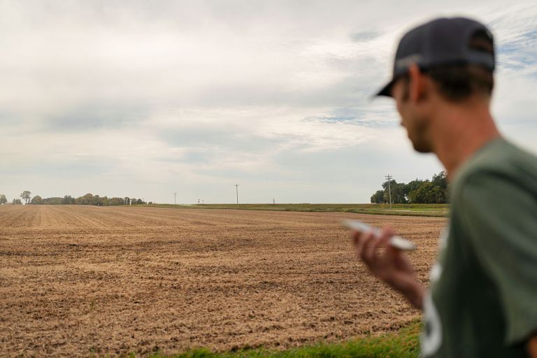 A farmer during a soybean harvest at a farm outside St. Peter, Minnesota, US, on Tuesday, Sept. 30, 2025. US President Donald Trump said he would confront Chinese President Xi Jinping over Beijing's refusal to purchase American soybeans, a growing area of tension between the world's two largest economies. Photographer: Ben Brewer/Bloomberg via Getty Images