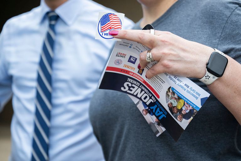 Virginia Attorney General Democratic candidate Jay Jones takes a photo with voters Bryan and Gretchen Foster outside of a voting precinct at Centreville High School on primary day, June 17, 2025 in Clifton, VA. (Craig Hudson For The Washington Post via Getty Images)