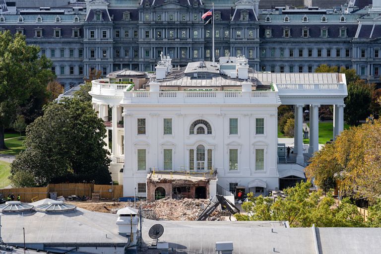 An excavator works to clear rubble after the East Wing of the White House was demolished on October 23, 2025 in Washington, DC. The demolition is part of U.S. President Donald Trump's plan to build a ballroom reportedly costing at least $250 million on the eastern side of the White House. (Photo by Eric Lee/Getty Images)