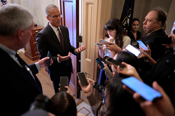 Senate Majority Leader John Thune (R-SD) talks to reporters while standing in the doorway of his office at the U.S. Capitol on the 29th day of the federal government shutdown on October 29, 2025 in Washington, DC. While keeping the House of Representatives out of session and away from Washington, Republican leaders blamed Democratic lawmakers for the continued federal government shutdown.