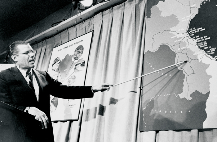 Secretary of Defense Robert McNamara points to a map of Vietnam during a press conference in Washington, D.C., on April 26, 1965. (Marion S Trikosko/PhotoQuest/Getty Images)