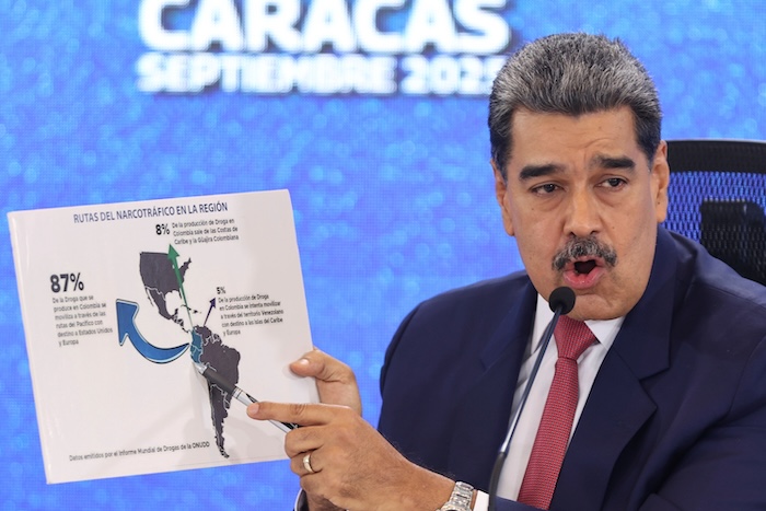 Venezuelan President Nicolas Maduro points at a map of the Americas during a new conference in Caracas, Venezuela, Sept 15, 2025. (AP Photo/Jesus Vargas),
