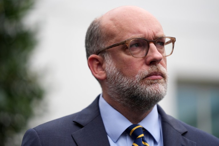 Russell Vought, Office of Management and Budget director, listens as he addresses members of the media outside the West Wing at the White House.