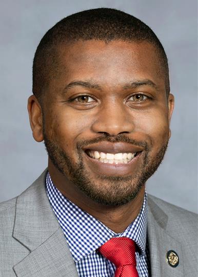 Brockman smiles for his portrait.