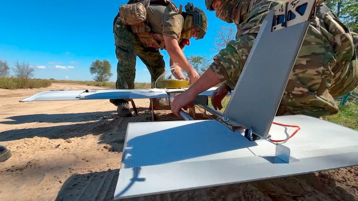 Russian soldiers prepare a drone for an action in an undisclosed location in Ukraine