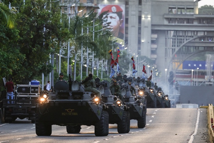 Armored tanks drive down the street in Caracas, Venezuela