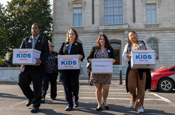 Parents with national advocacy group ParentsTogether Action deliver a 100,000-signature petition to Congress in Washington, D.C. on September 12, 2024 urging lawmakers to pass the Kids Online Safety Act. (Eric Kayne/AP Images for ParentsTogether Action)