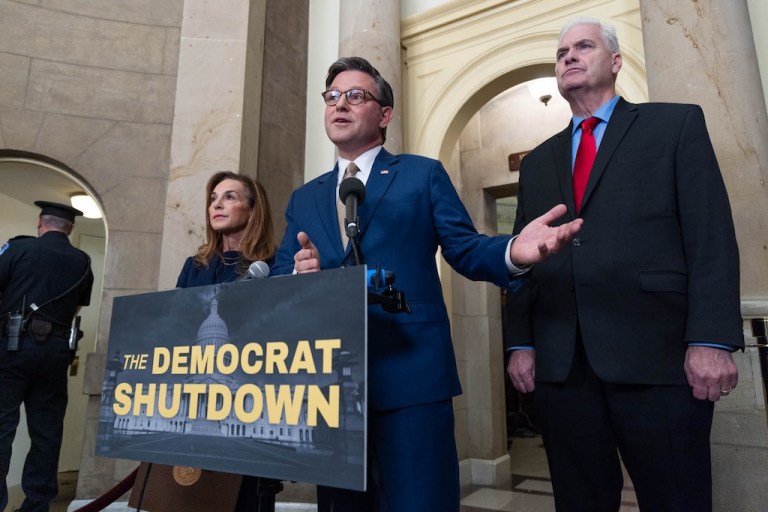 House Speaker Mike Johnson (R-LA), alongside Rep. Lisa McClain (R-MI), left, and House Majority Whip Tom Emmer (R-MN), right, speaks during a news conference outside of his office