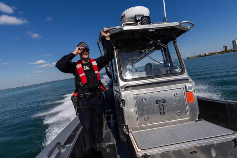 U.S. Coast Guard officers conduct a patrol for illegal fishing vessels.