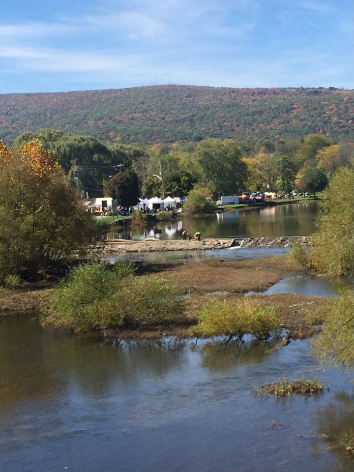 The Juniata River hugging the town of Bedford, where the Living Treasures animal park offers pony rides for children during the over 300-vendor fall foliage festival this weekend.